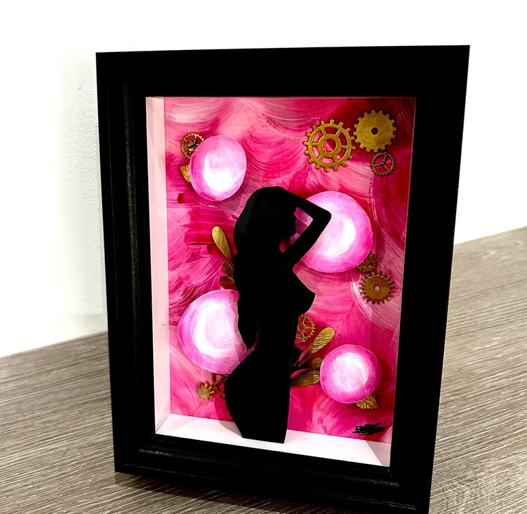 a picture of a woman silhouetted against a pink flower