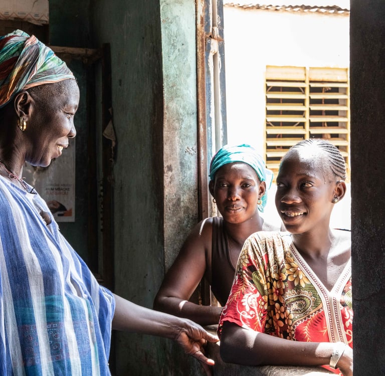 Fanta Wilane, a smallholder farmer with her two daughters
