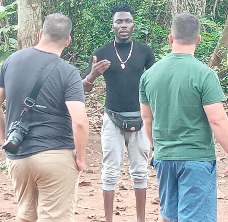 Dahomey African Tours Guide leading Tourists in the Sacred Forest in Ouidah in Benin