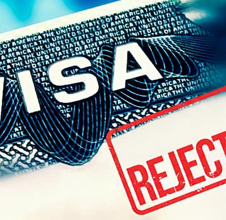 Close-up of a visa document with the word VISA visible, overlaid with a large red, rubber-stamp styl