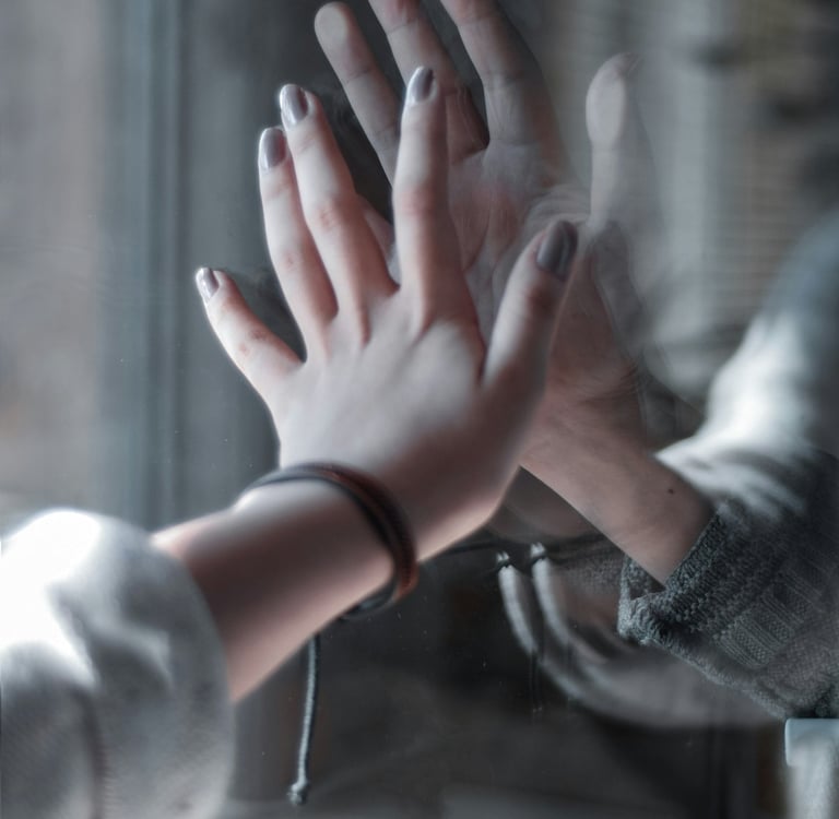 a person holding their hands up to a person's hand