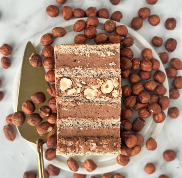 a piece of cake with nuts and nuts on a plate
