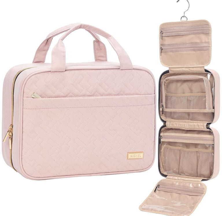 Pink quilted hanging toiletry bag with multiple zipper compartments for organized travel storage.