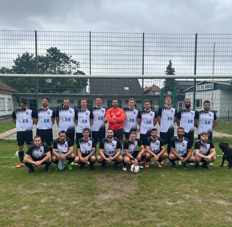 a group of men and women soccer players posing for a photo