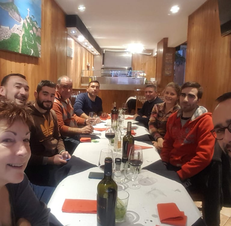a group of people sitting around a table
