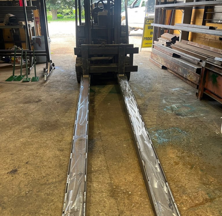 fork lift fork extensions displayed on fork lift