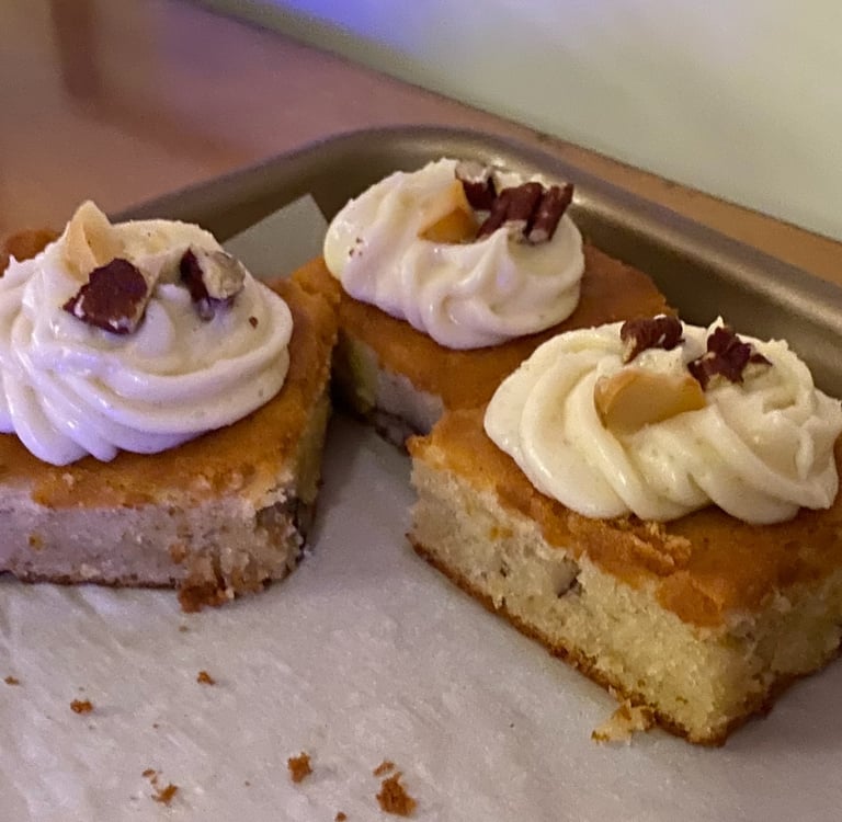 3 frosted cake bars on a sheet pan