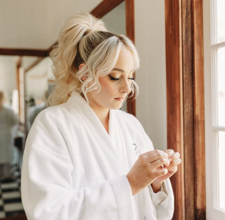 a woman in a white robe is holding a cell phone