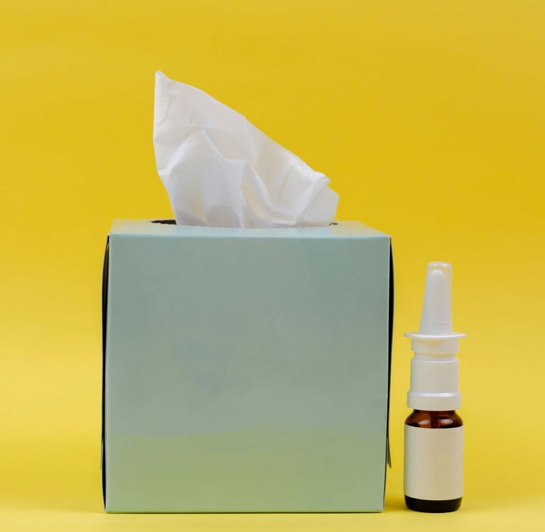 a tissue box with a tissue paper towel and a bottle of essential oils