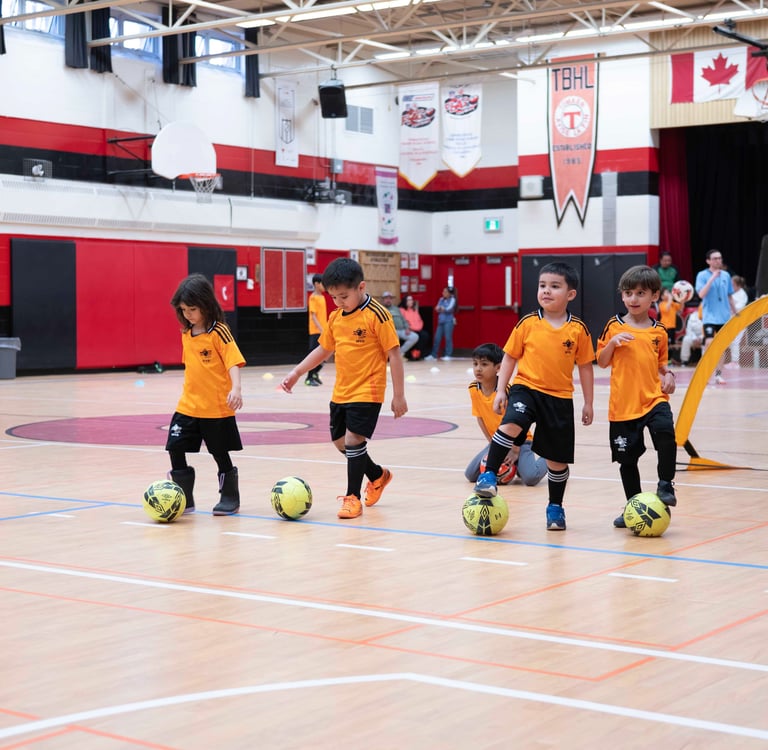 Beginner soccer training for kids in Mississauga practicing ball control with MVB F.C.