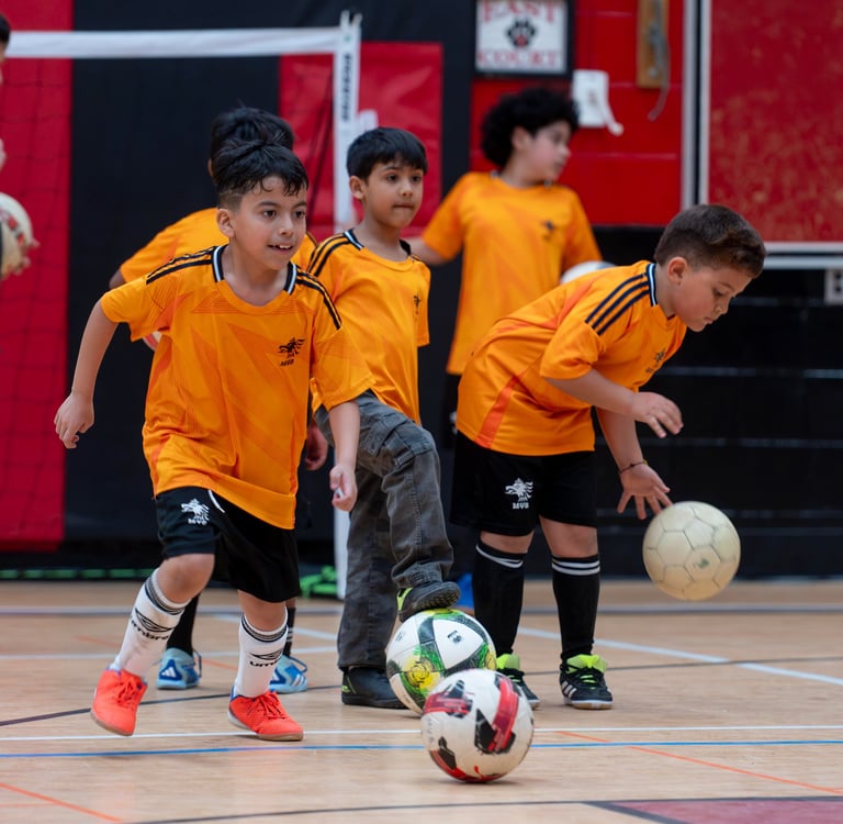 MVB FC players practice soccer drills and ball control at an indoor in soccer school in Mississauga