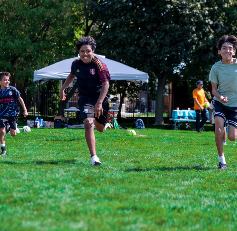 outdoor summer camp for kids playing soccer in Mississauga