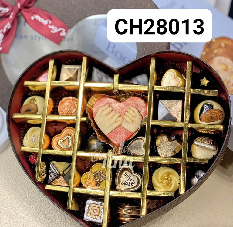 a heart shaped box with chocolates and candy