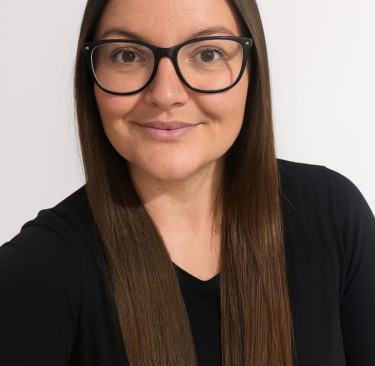 a woman with glasses and a black top