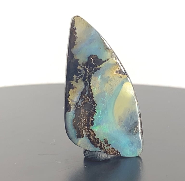 Stunning blues and greens amongst Ironstone. Queensland Boulder Opal from Australia.
