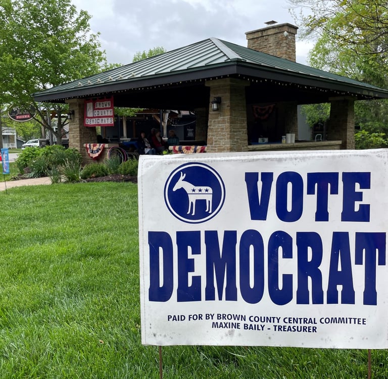 Yard sign reading Vote Democrat in front of downtown Nashville pavilion