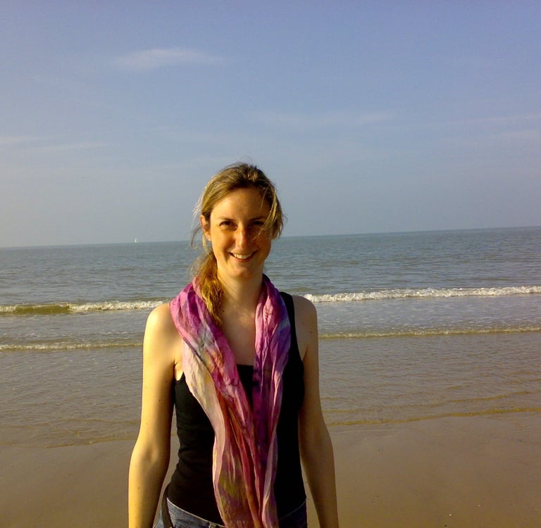 Friendly smiling woman at the beach