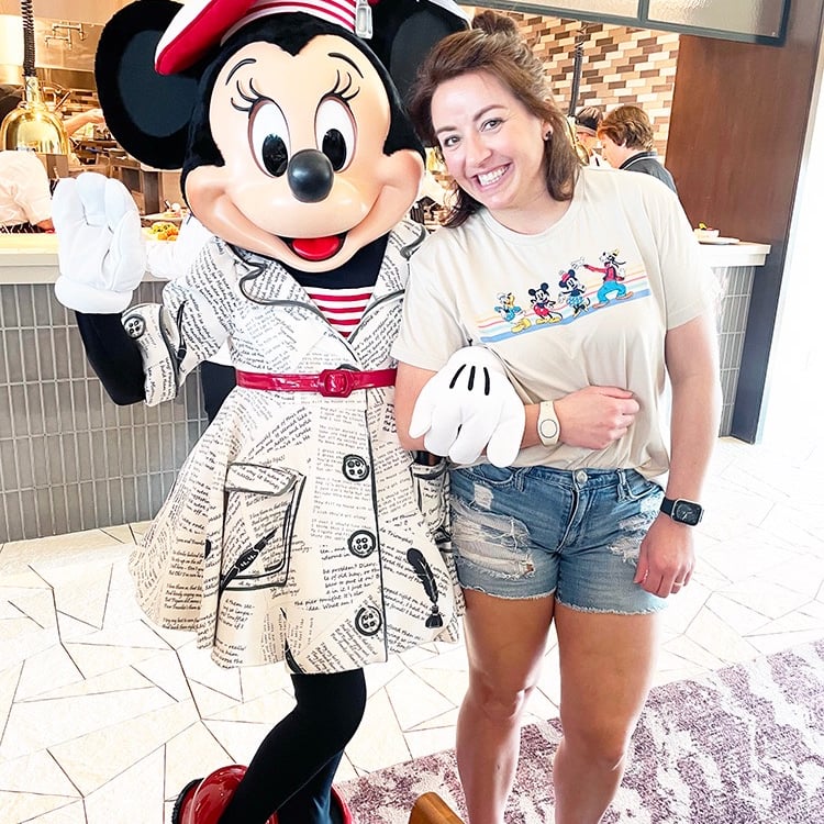 Dasee Johnson pictured with Minnie Mouse at Walt Disney World®.