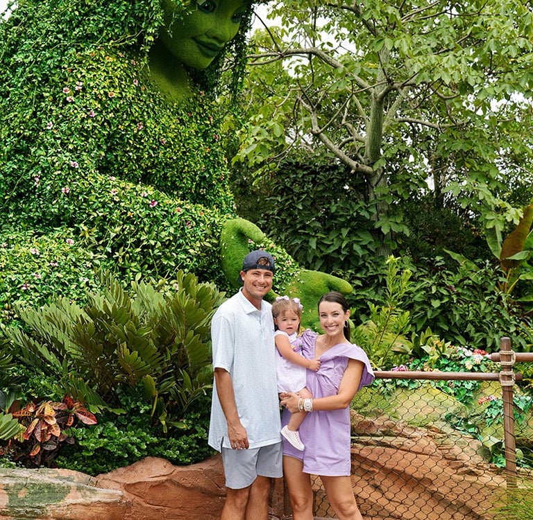 Jessica Henderson pictured with her family at Journey of Water inside EPCOT® at Walt Disney World®.