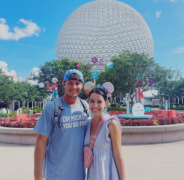 Jessica Henderson pictured in front of Spaceship Earth inside EPCOT®.