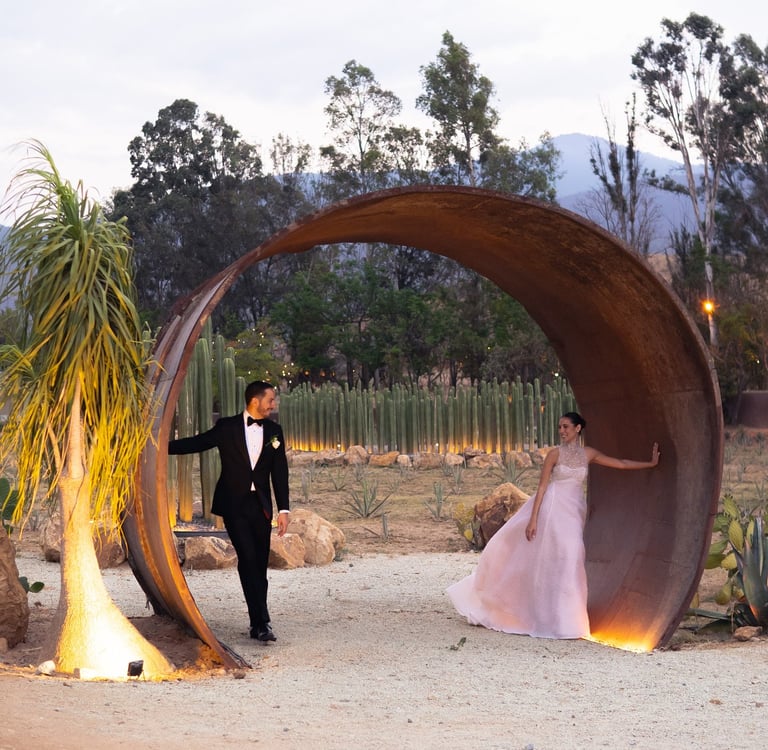 a man in a tuxedo suit and a woman in a pink dress