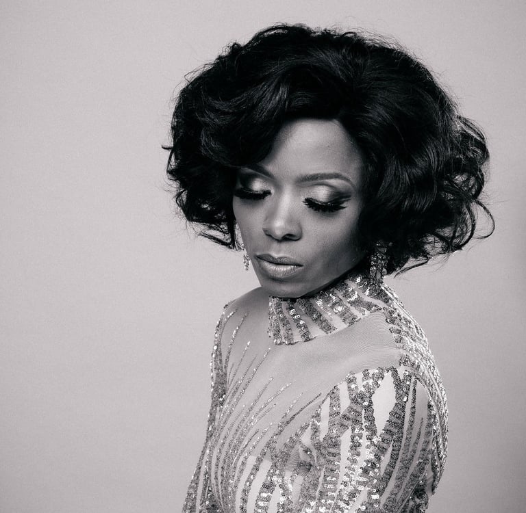 a woman in a sequinous dress with a large hairdo