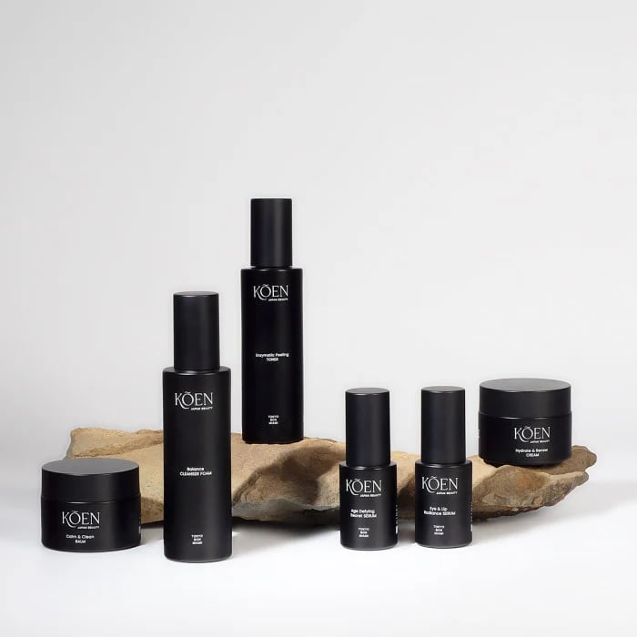 a group of black and white skin care products