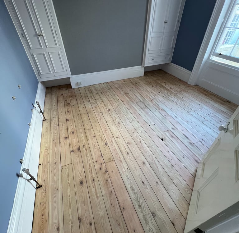 Stripped pine floorboards in Worthing Sussex, wooden floor restoration before finish