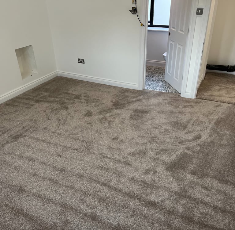Carpeted bedroom flooring installation in Brighton Sussex, professional interior finish