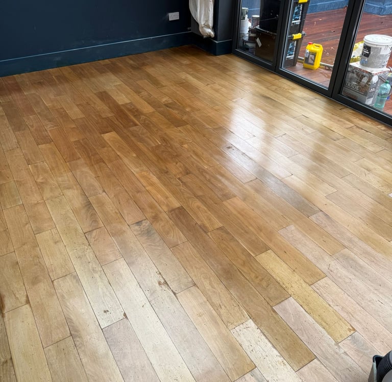  Living room installed and refinished light oak hardwood flooring with a polished finish in Sussex. 