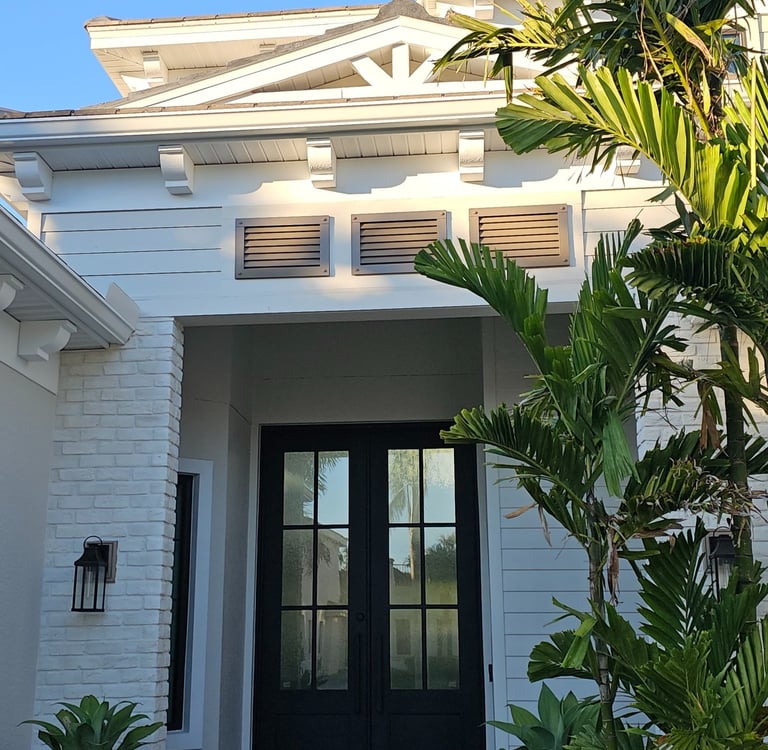 Louver panels above the luxury home entrance 