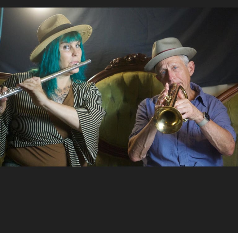 Two band members play music together