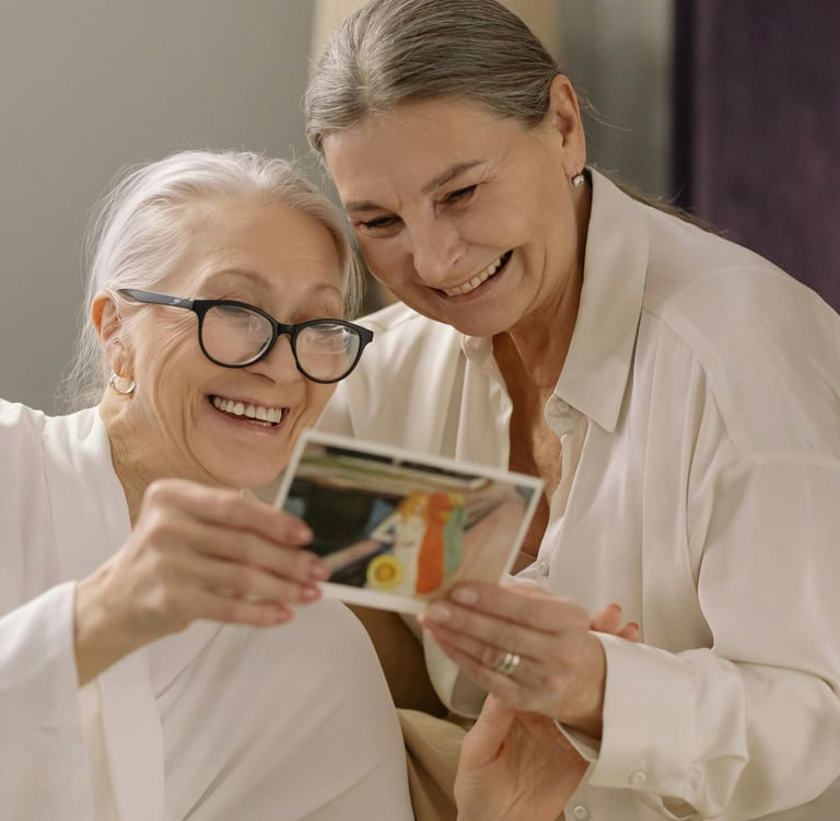 Two women sharing a photograph