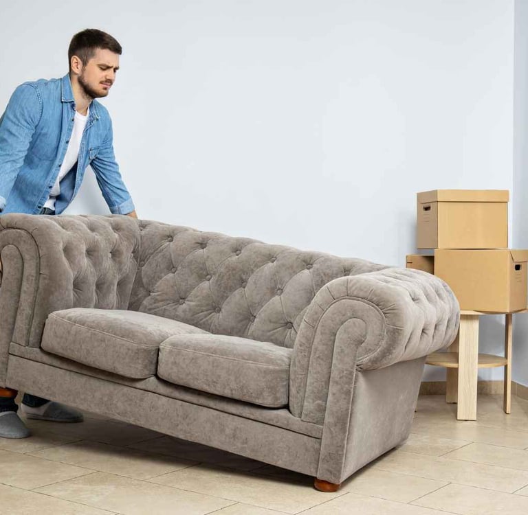 man moving sofa