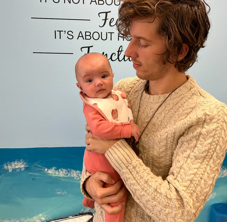 Gentle chiropractic adjustment for a baby at Three Nails Chiropractic in Franklin TN