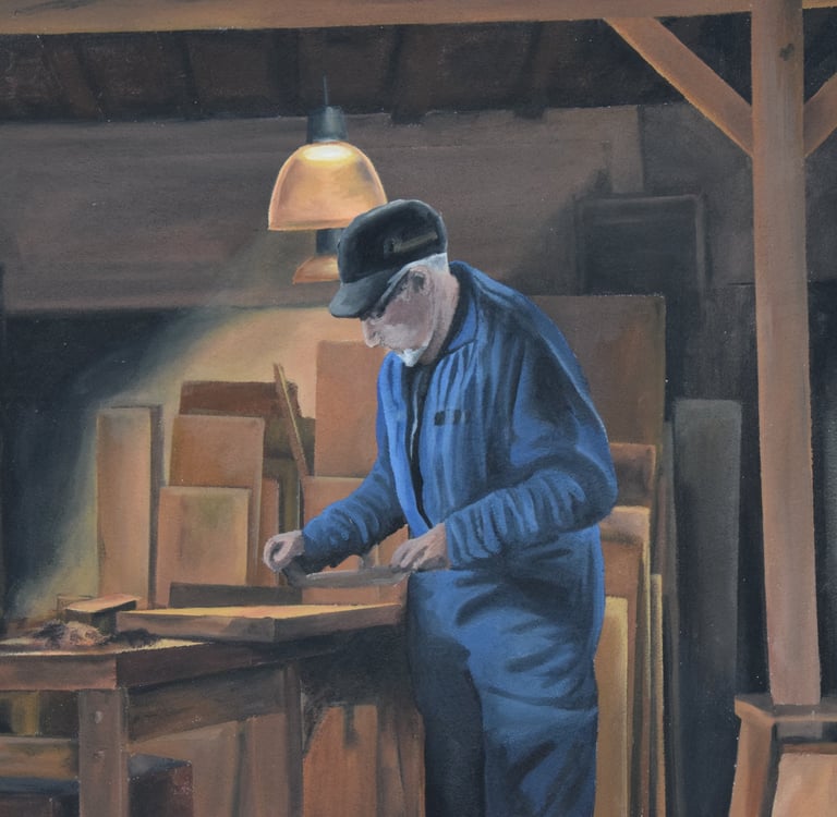 Détails d'une fresque peinte sur façade: un menuisier travaille le bois dans son atelier. Jura 39.