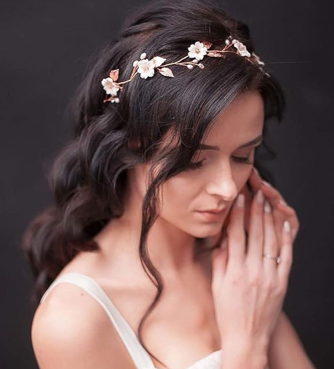a woman wearing a white dress and a flower crown