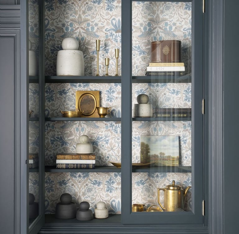 a cabinet with a glass door and a shelf with dishes