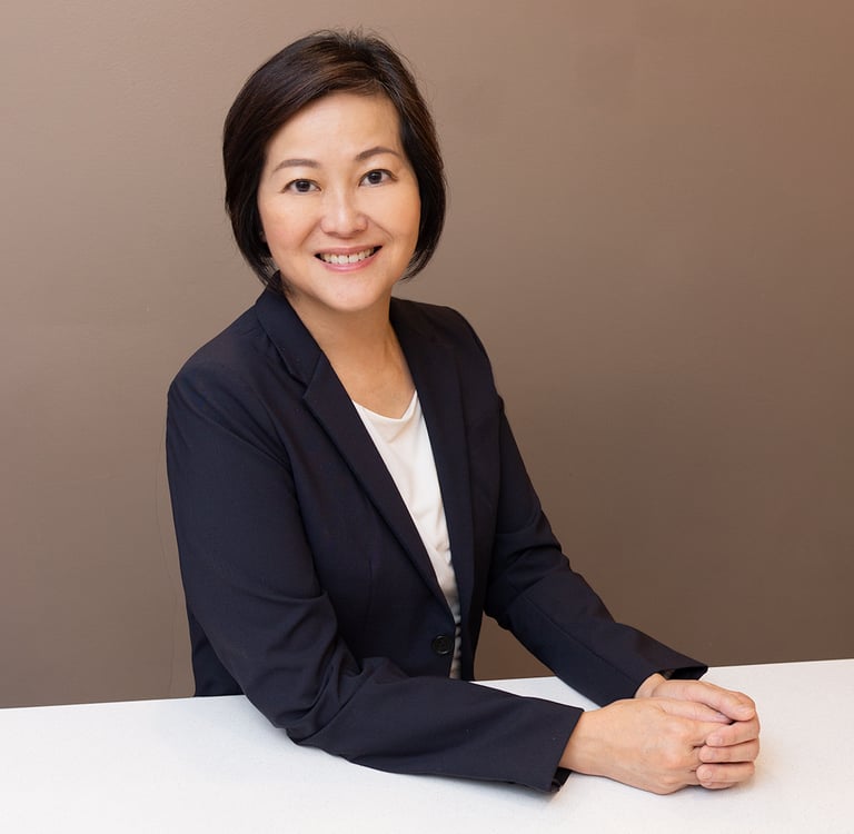 a woman in a suit smiling
