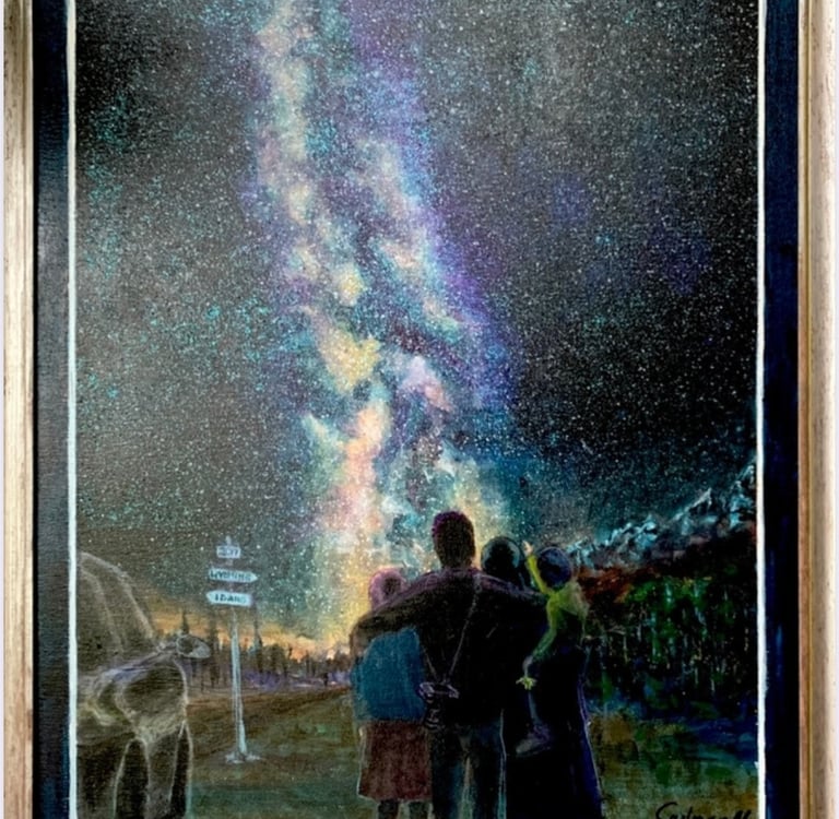 Family of four admiring Milky Way in the mountains
