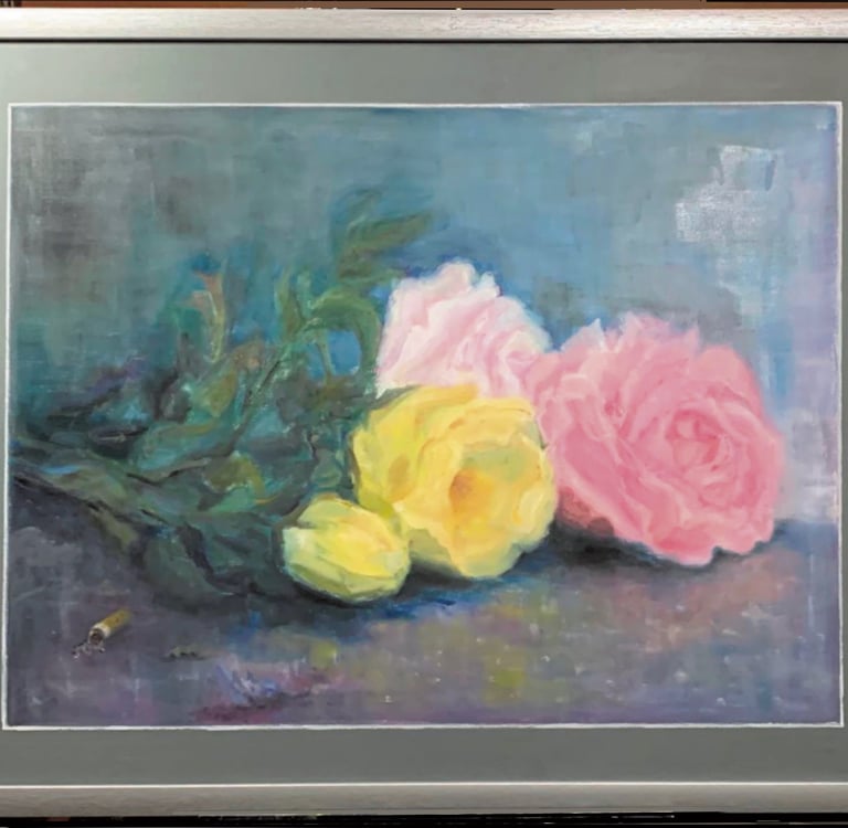 Discarded bouquet of tender roses lying on the pavement