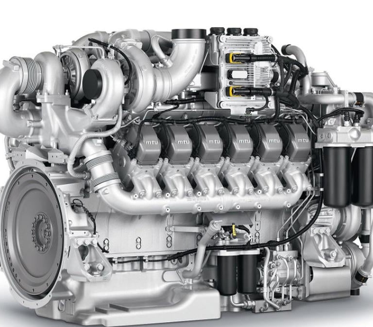A high-performance MTU marine diesel engine with a multi-cylinder block and turbocharger on a white background.