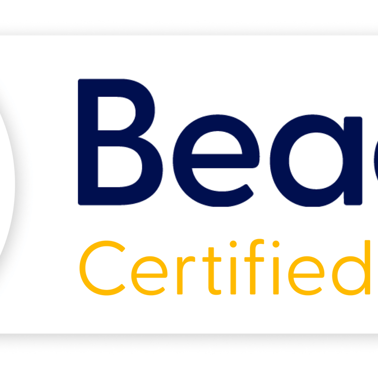 The Beacon logo. A symbol of a flaming torch in blue and red, with words Beacon Certified Partner