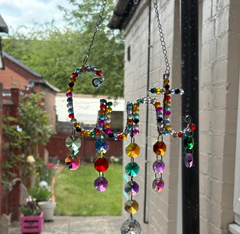 A Random Rainbow Cunt catcher in its new home with a fellow sweary business, Swears of Joy