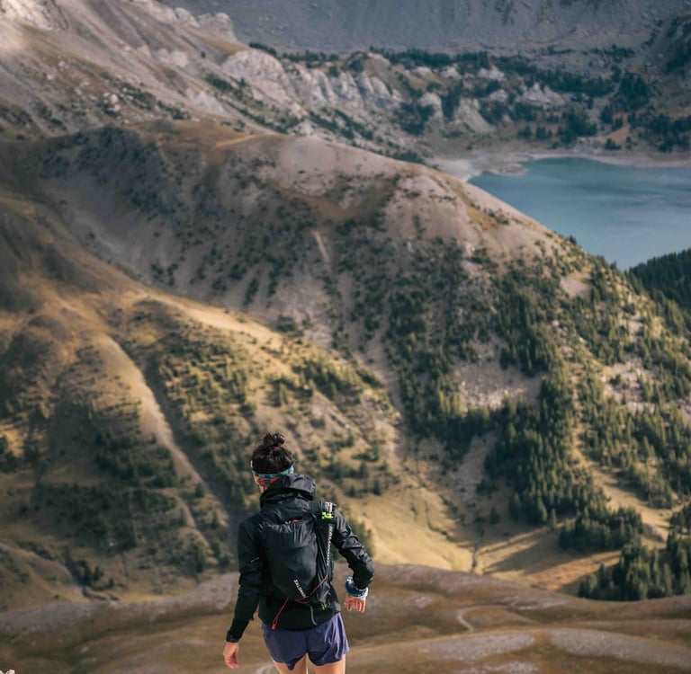 Girl trail runner in the moutain