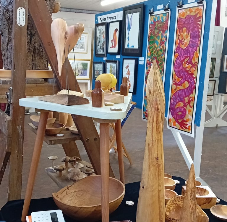 Our stall at the exhibition with paintings behind