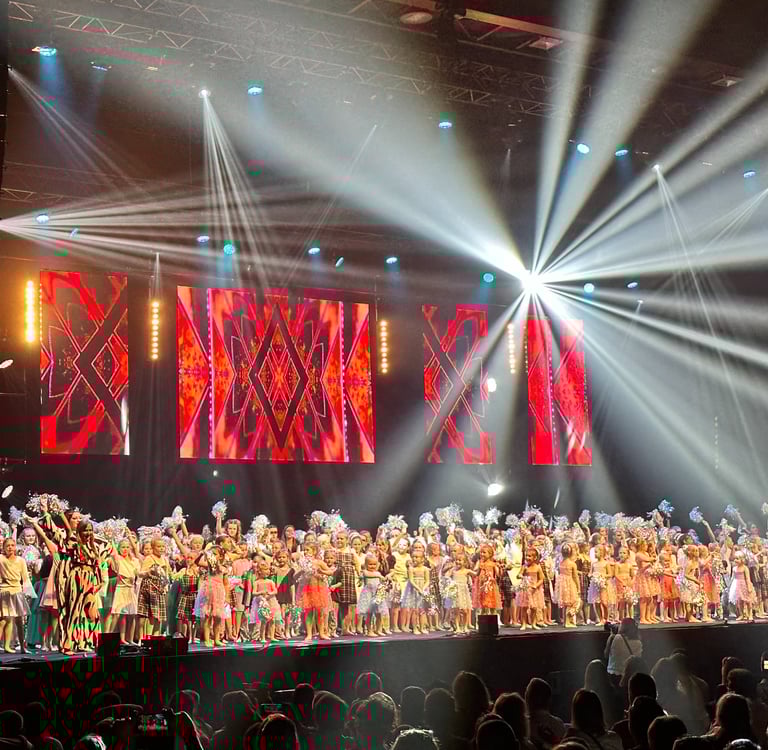 a large group of people standing on a stage