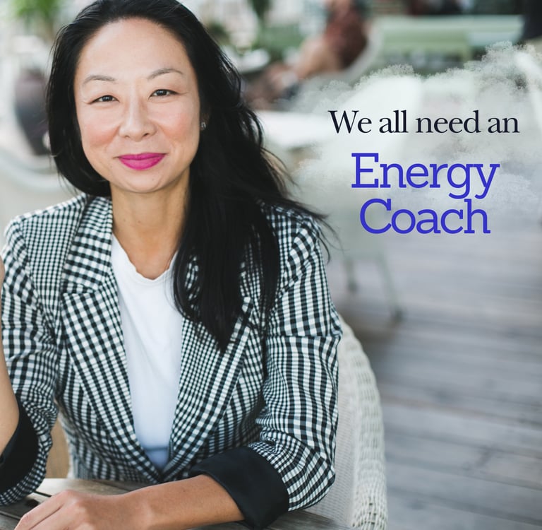 elisa choy in a professional casual jacket smiling and sitting at a table