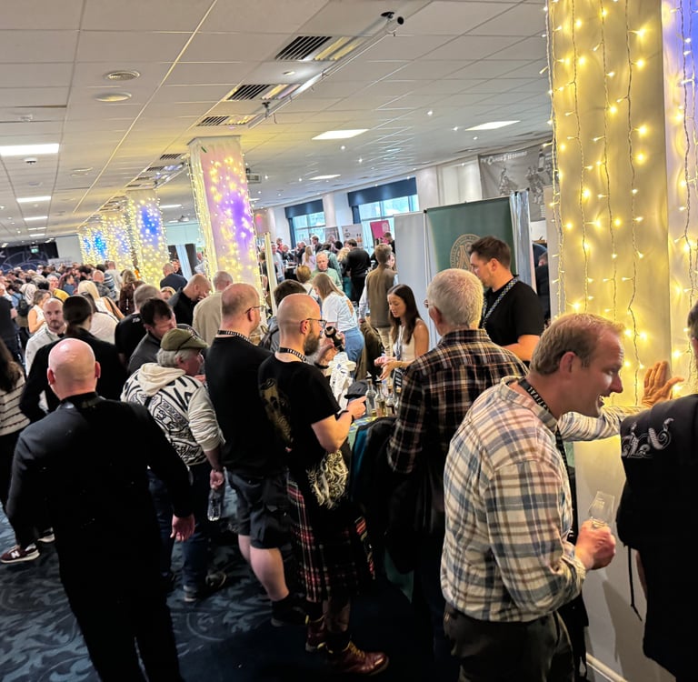 group shot of people at The Edinburgh Whisky Whisky Festival in Edinburgh, Scotland.