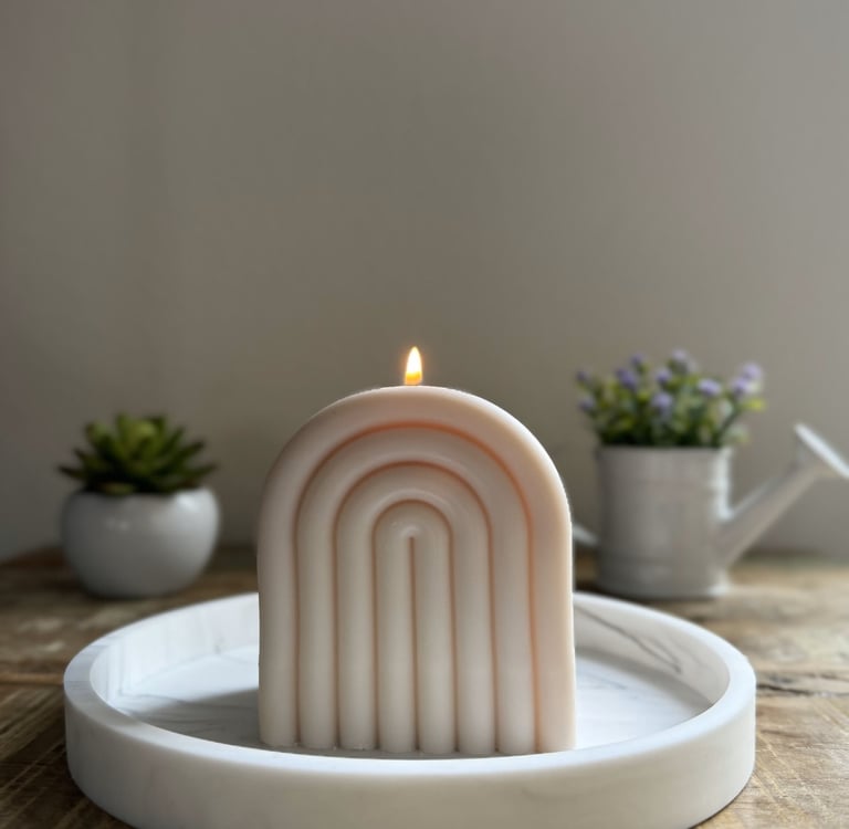 Arch candle lit over a plate